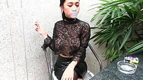 Young girl smokes topless in leather skirt and heels outdoors!