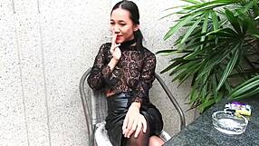 Young girl smokes topless in leather skirt and heels outdoors!