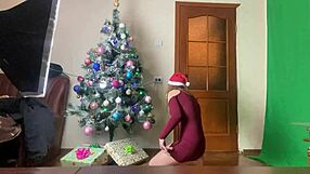 stacy decorating the christmas tree in black pantyhose