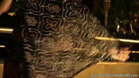 This sensual Indian brunette undresses and dances in a captivating striptease.