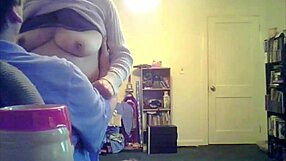 loris, the brunette milf, shows off her big tits in the living room setting