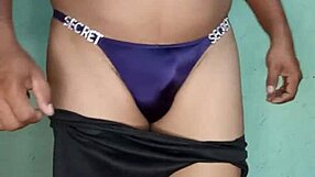 I dance in a purple satin thong from victoria's secret, teasing with lingerie and toys.