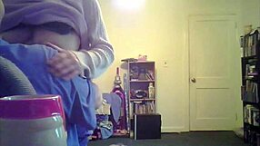 loris, the brunette milf, shows off her big tits in the living room setting