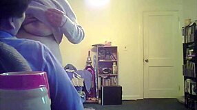 loris, the brunette milf, shows off her big tits in the living room setting