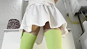 Brunette coed flashes panties in bathroom