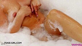 Delightful young brunette model enjoys a relaxing bath during photoshoot.