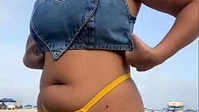 African exhibitionist flashes and arouses guy on beach