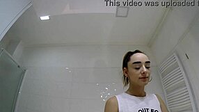 Brunette coed flashes panties in bathroom