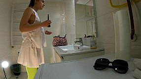 Brunette coed flashes panties in bathroom