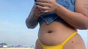 African exhibitionist flashes and arouses guy on beach