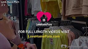 Girlfriend kneels in changing booth for blowjob.