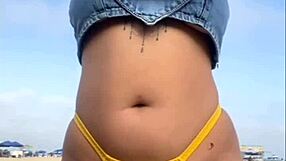 African exhibitionist flashes and arouses guy on beach