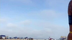 African exhibitionist flashes and arouses guy on beach