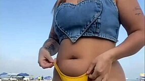 African exhibitionist flashes and arouses guy on beach