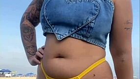 African exhibitionist flashes and arouses guy on beach