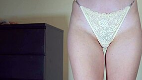 sexy schoolgirl tries on cotton panties, showing her hairy pussy