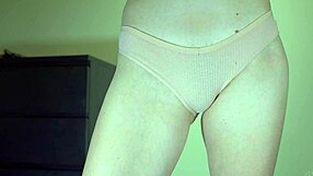 sexy schoolgirl tries on cotton panties, showing her hairy pussy