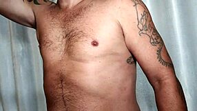 Brazilian pornstar with huge tattooed cock masturbates and cums in solo scene