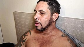 Brazilian pornstar with huge tattooed cock masturbates and cums in solo scene