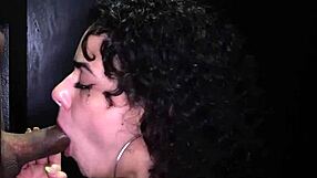 gorgeous hot brunette intensely deepthroats dicks at gloryhole