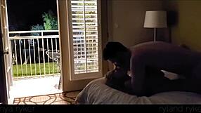 Young couple enjoys intimate time in motel with door open