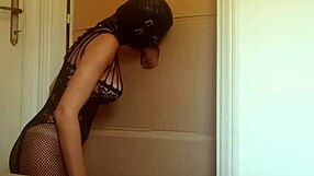 In a nylon catsuit and high heels, she sucks a cock and fucks it in a gloryhole until it cums in her mouth
