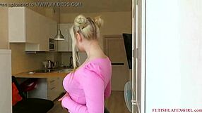 blonde walks around the room in tight leggings