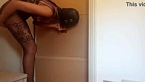 In a nylon catsuit and high heels, she sucks a cock and fucks it in a gloryhole until it cums in her mouth