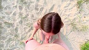 Sucking off my best friend at the public beach and taking cumshot on my pretty face