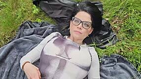 She is smoking on the grass and decides to show her boobs under the sun