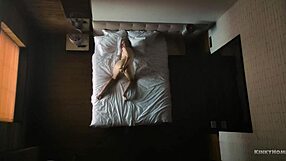 Hidden cam captures milf solo in bed
