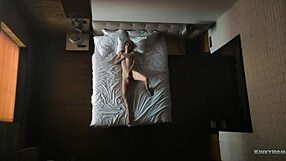 Hidden cam captures milf solo in bed