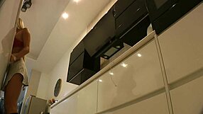 Feeling aroused by the big boobs blonde housewife in kitchen without panties.