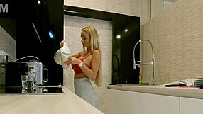 Feeling aroused by the big boobs blonde housewife in kitchen without panties.