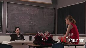 Tiny cheerleader helps teacher in classroom setting.