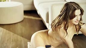 Beautiful girl poses naked with long legs and small waist.