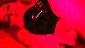 redhead milf engages in bdsm pussy fucking and ass fingering solo. toys and latex add to the fetish play.