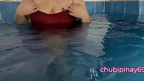 flashing balloons in the public swimming pool. lots of fun with friends outdoors.