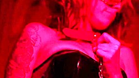 redhead milf engages in bdsm pussy fucking and ass fingering solo. toys and latex add to the fetish play.