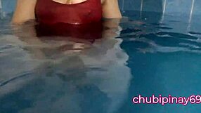 flashing balloons in the public swimming pool. lots of fun with friends outdoors.