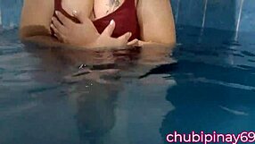 flashing balloons in the public swimming pool. lots of fun with friends outdoors.