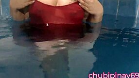 flashing balloons in the public swimming pool. lots of fun with friends outdoors.