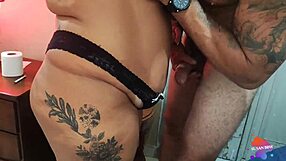 Curvy Woman in Black Lingerie Gifts Cousin at Graduation Party