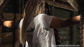 the brunette slave moans under the busty blonde's strapon