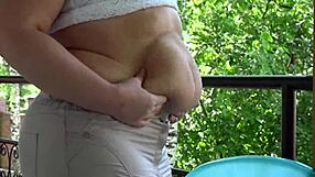 Chubby MILF enjoys a mukbang with her fat belly in an outdoor ASMR session.