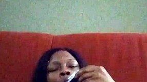 Black ebony woman with hairy pussy makes herself creamy by rubbing intensely.