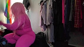 Trying on this stretchy pink bodysuit in the mirror