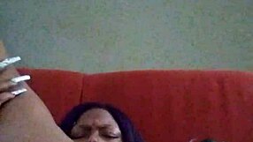 Black ebony woman with hairy pussy makes herself creamy by rubbing intensely.