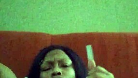 Black ebony woman with hairy pussy makes herself creamy by rubbing intensely.