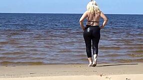 Big leather ass strolls beach in heels and naked